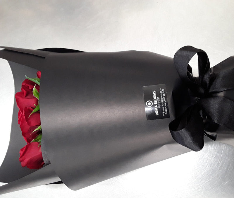 6 red roses black wrapped 