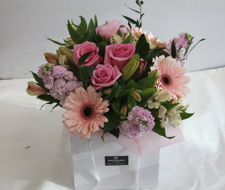 pink flowers in a bag for birthdays