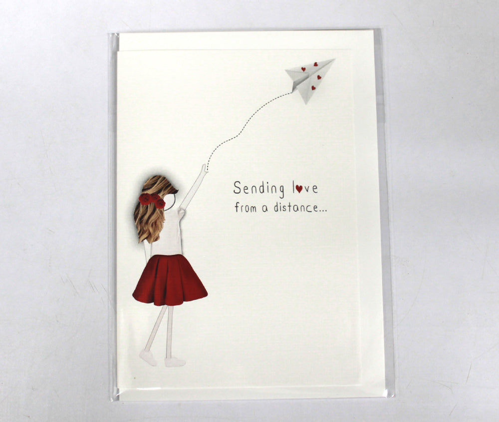 girl throwing a paper dart