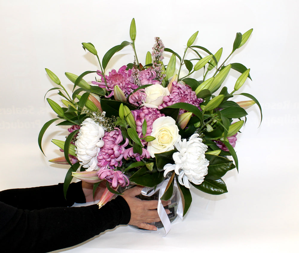 Mixture Of Seasonal Blooms In A Vase