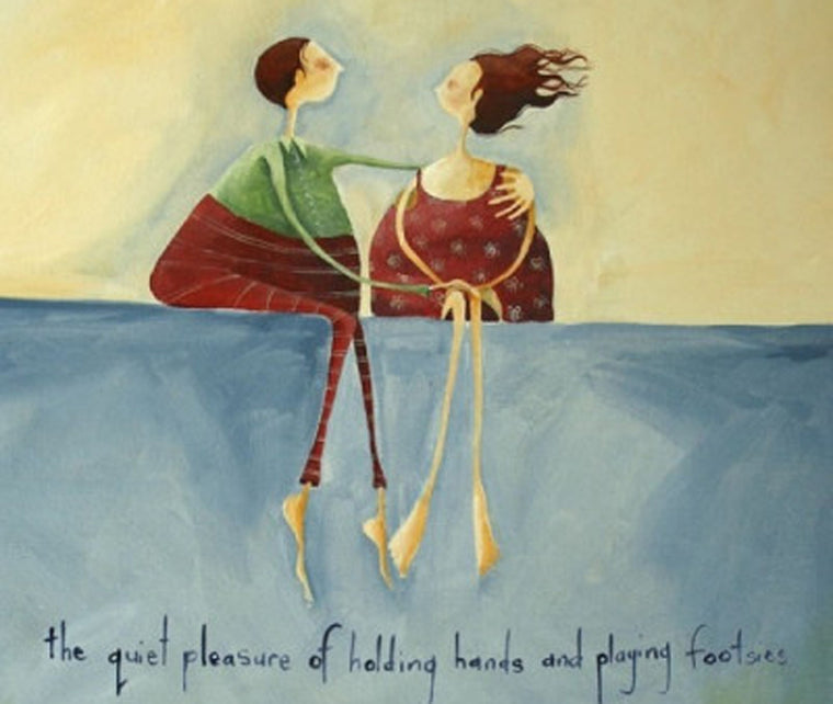 couple hugging, sitting on a wall